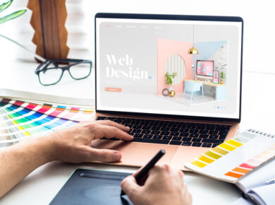 Designer working on a custom web design project for Calgary businesses, showcasing color palettes and creative tools.